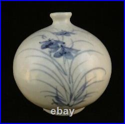 Korean blue and white vase. Flower motif, artist signed. 4 3/4 t